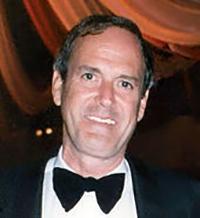 Smiling man in a dinner jacket and bow tie