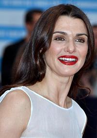 Smiling woman with dark hair and red lipstick