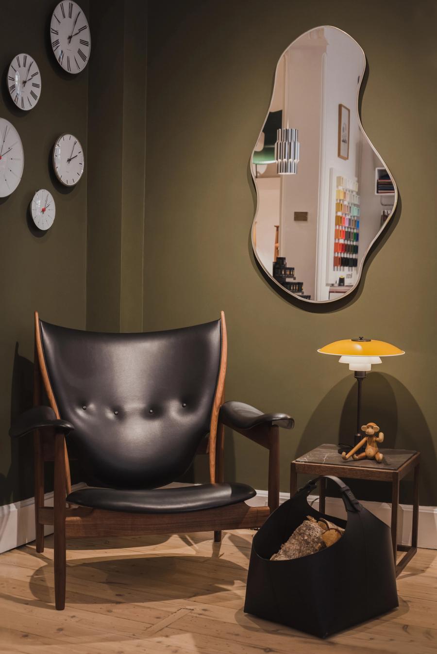 Leather armchair and mirror in a homeware shop