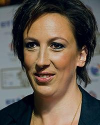Woman with short dark hair smiling