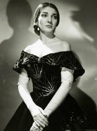 Black-and-white portrait of a woman in an off-the-shoulder evening gown