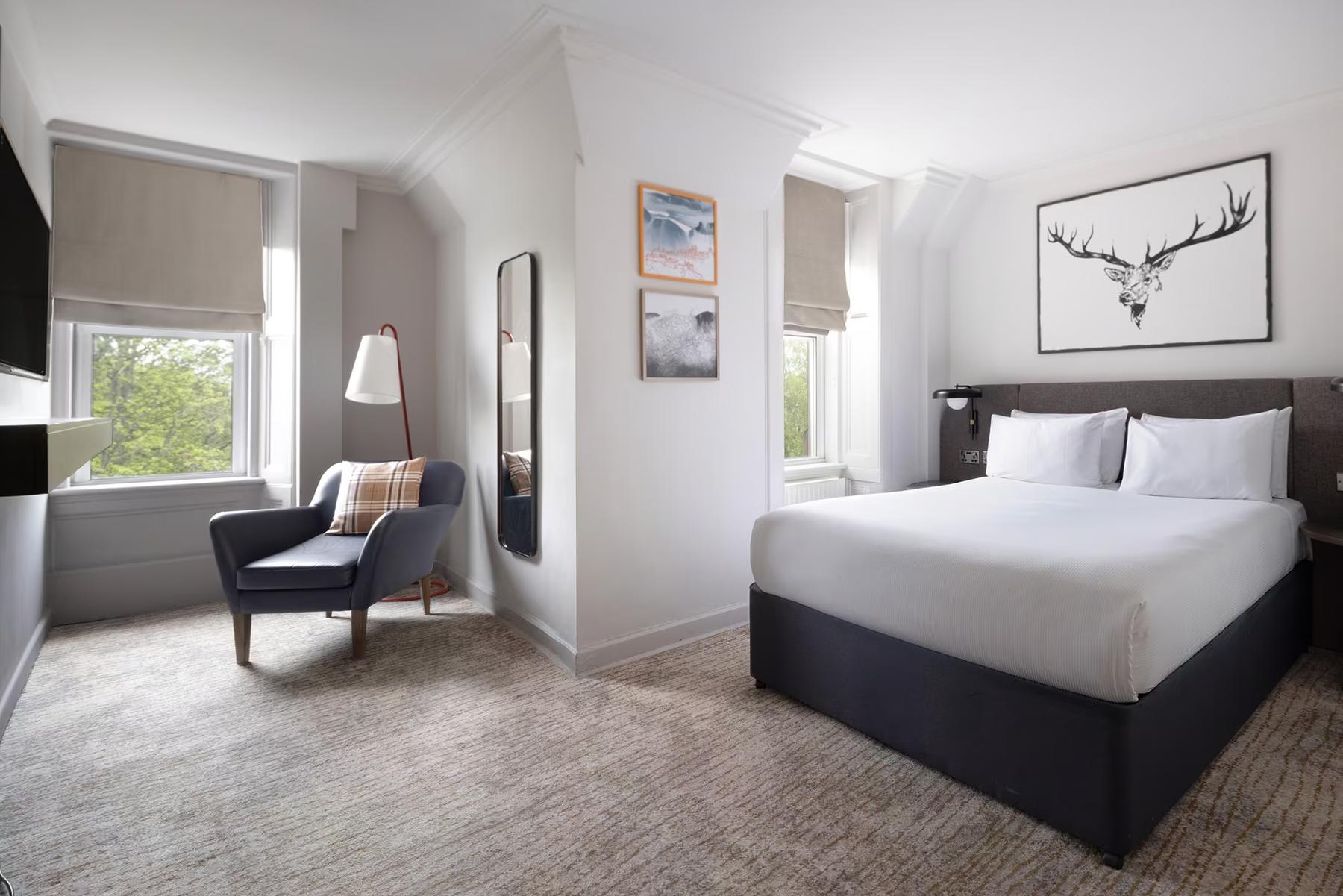 Standard double bedroom with a stag print above the bed