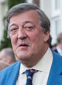 Man in a blue jacket at an outdoor event