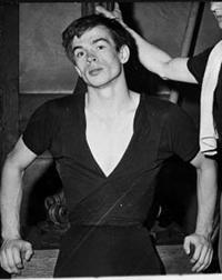 Black-and-white photo of a male ballet dancer