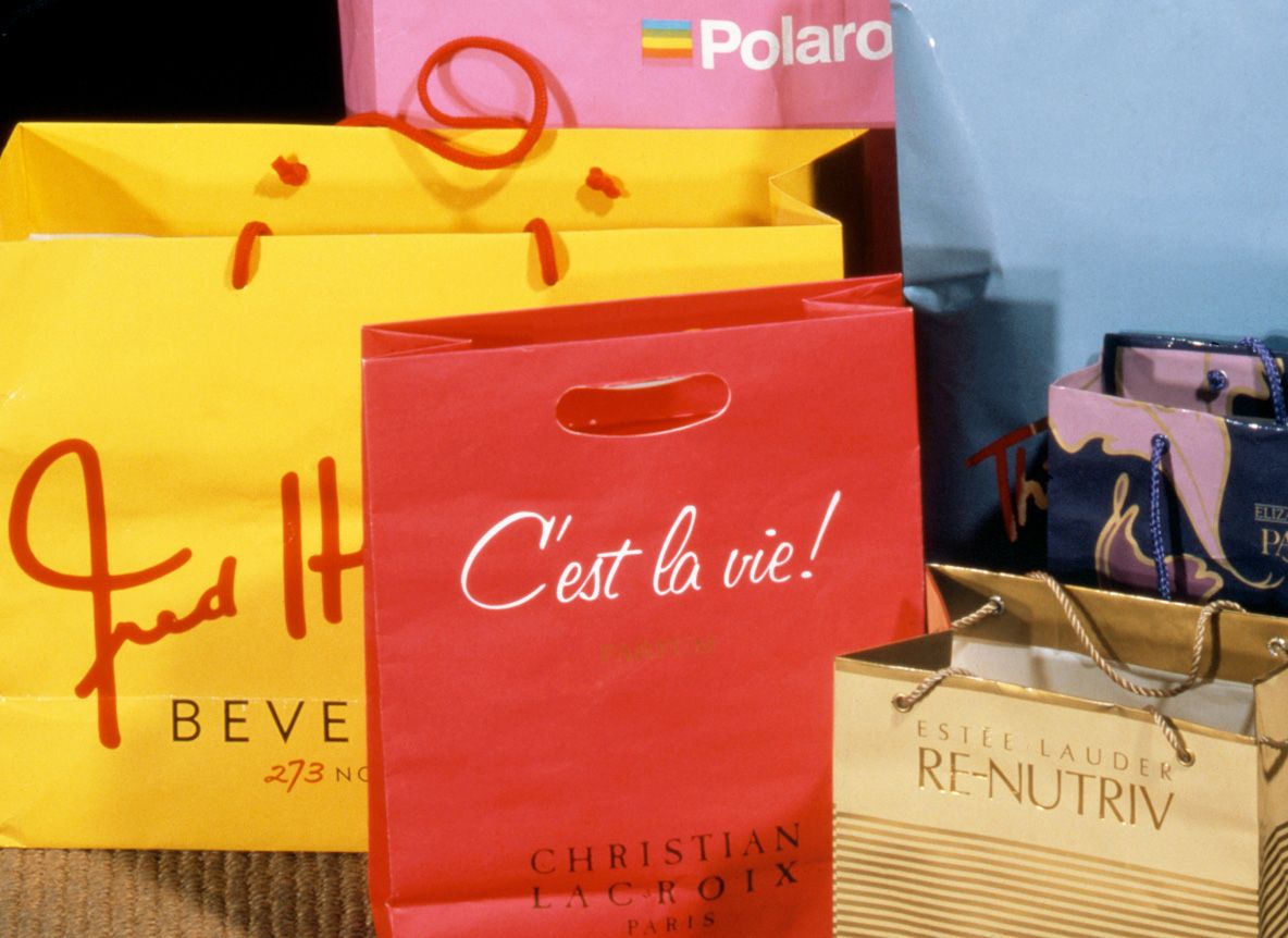 Woman sitting on table in art studio