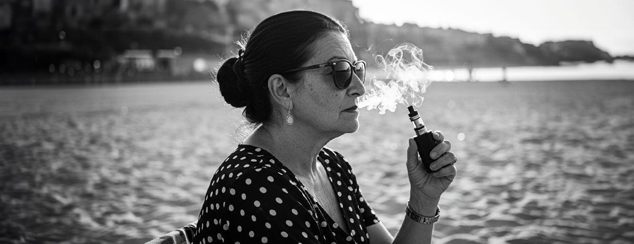 Lady vaping on beach
