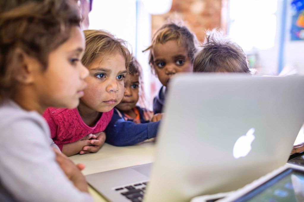 Children looking at a computer