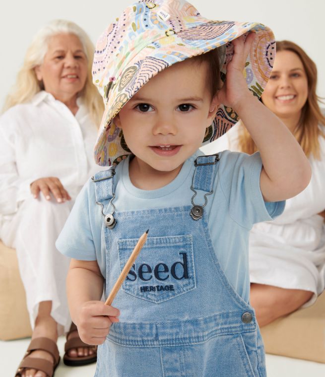 Child wearing the ALNF x Seed collaboration hat 