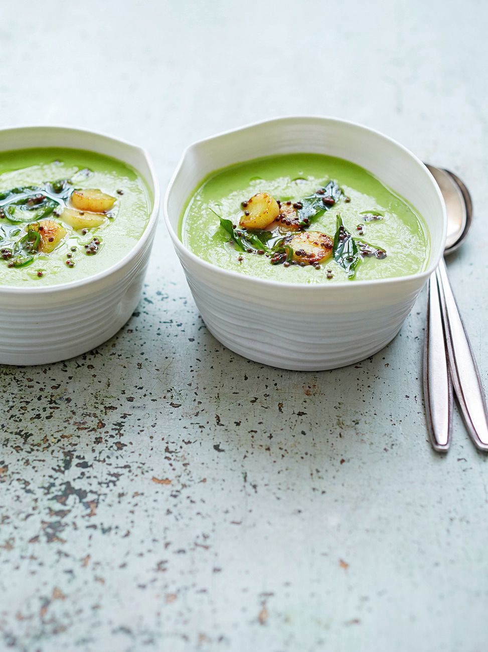 Pea soup with turmeric scallops