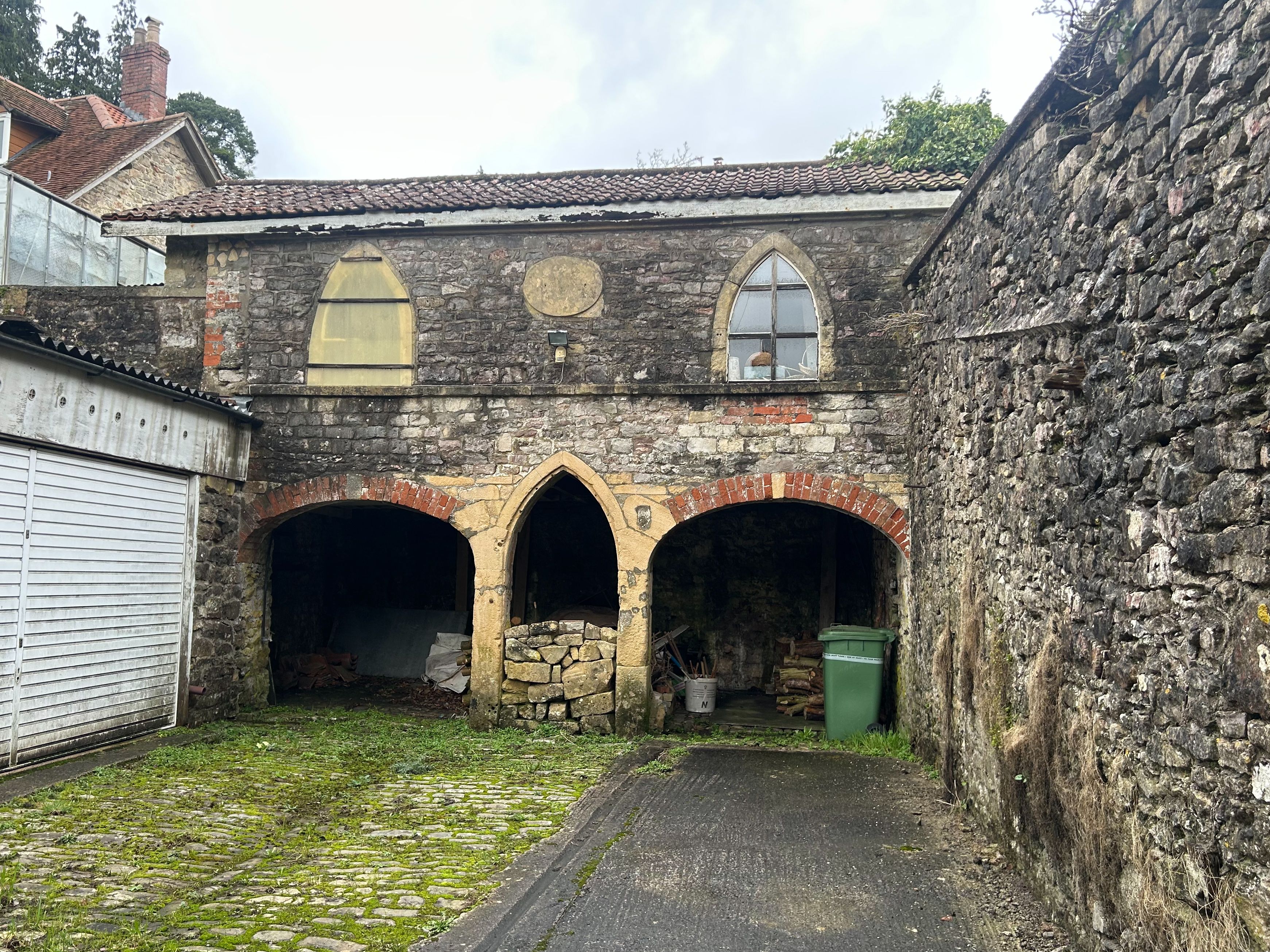 a garage under croft using bits of stone from an original methodist church