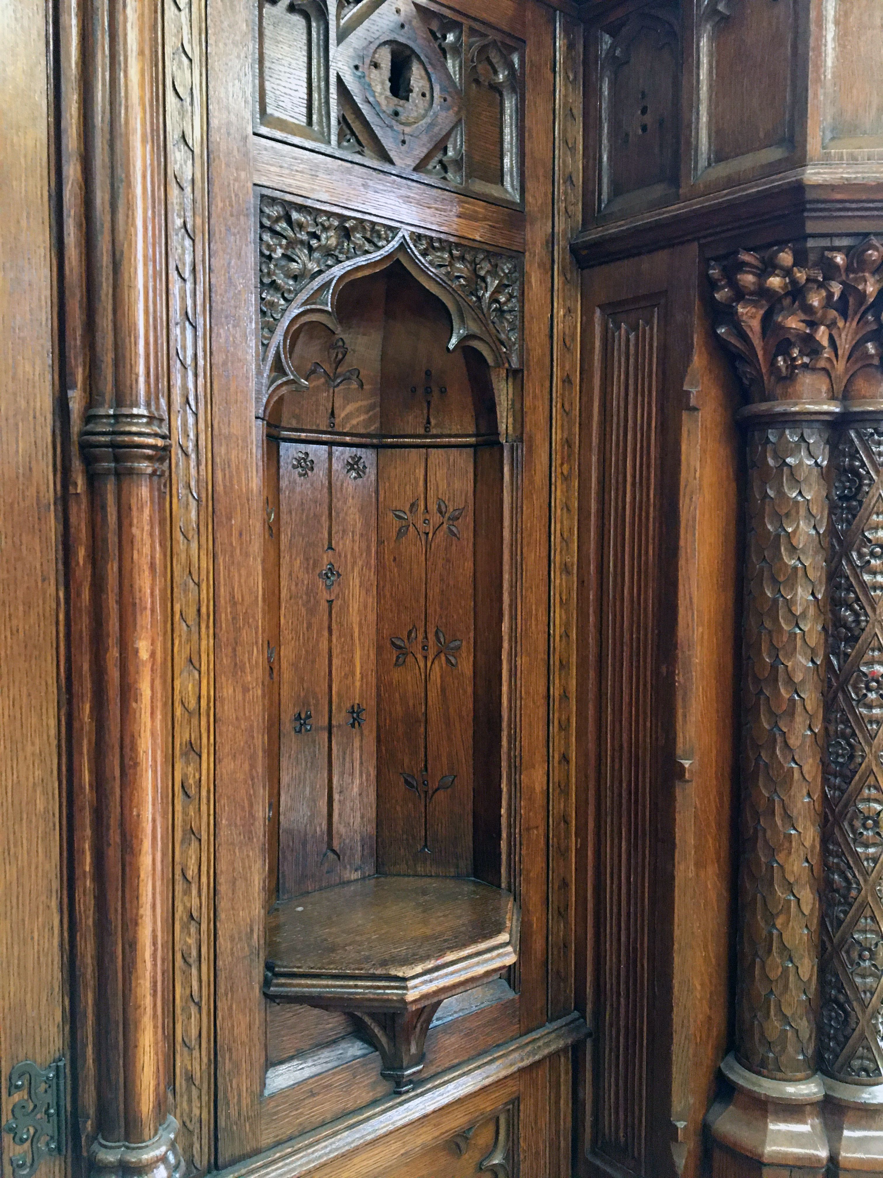 ornately carved wooden details from a bookcase