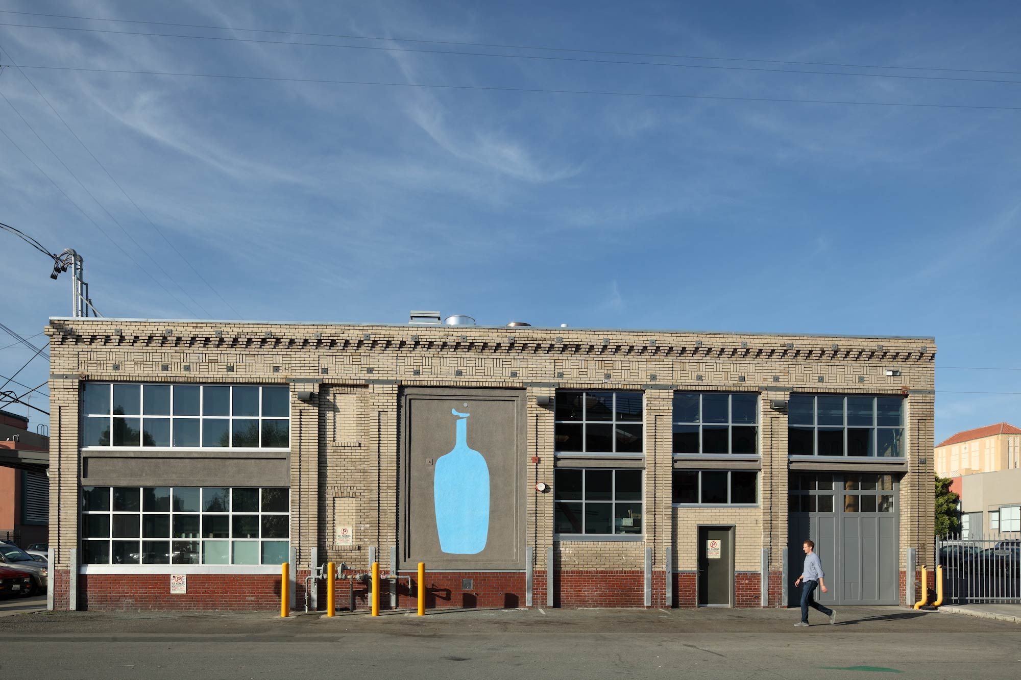 Former Oakland roastery with large Blue Bottle logo on face of the building