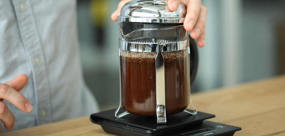 a french press on a Hario scale