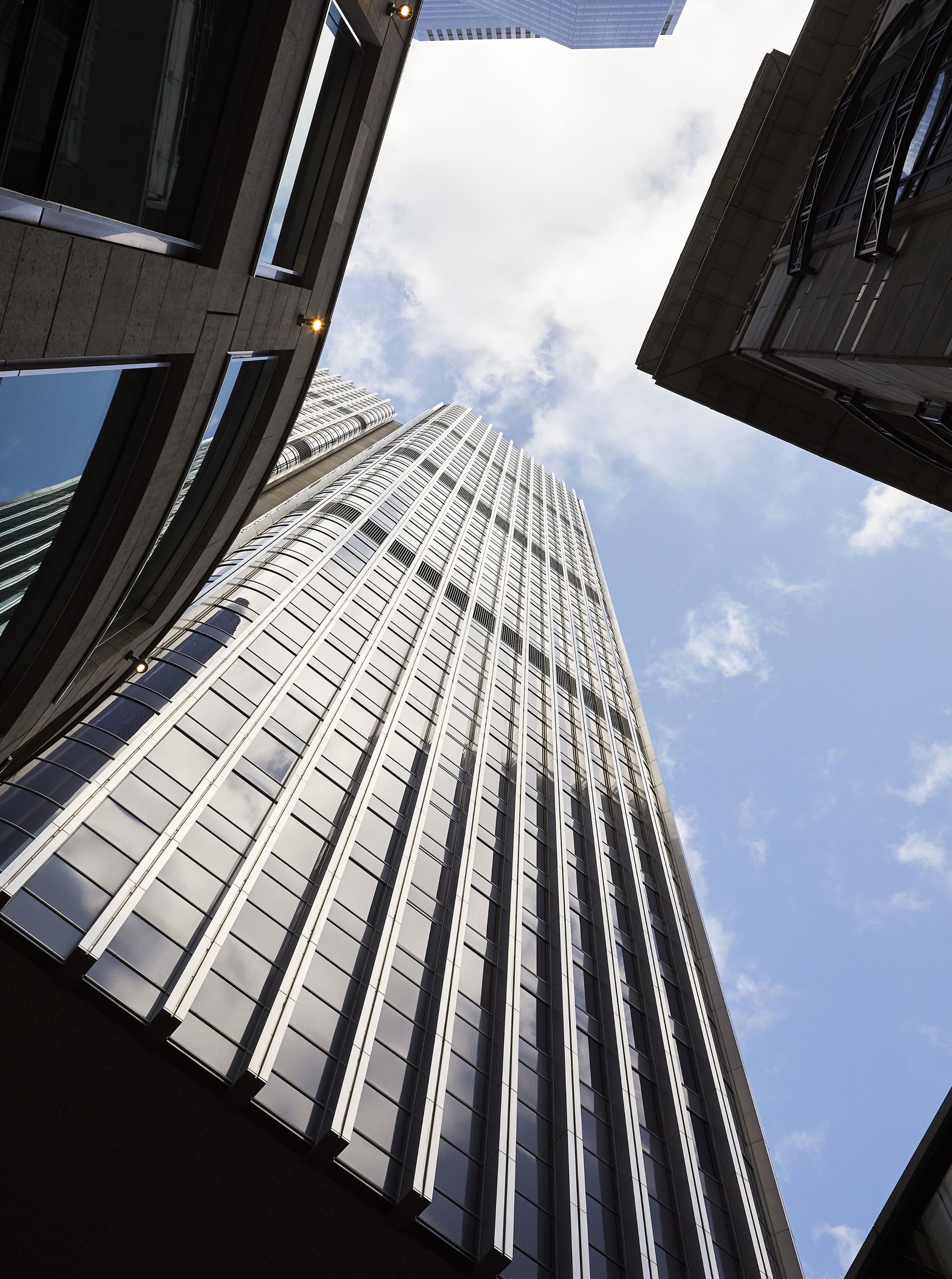 Tower 42's striking linear facade as seen from the ground floor retail pavilions