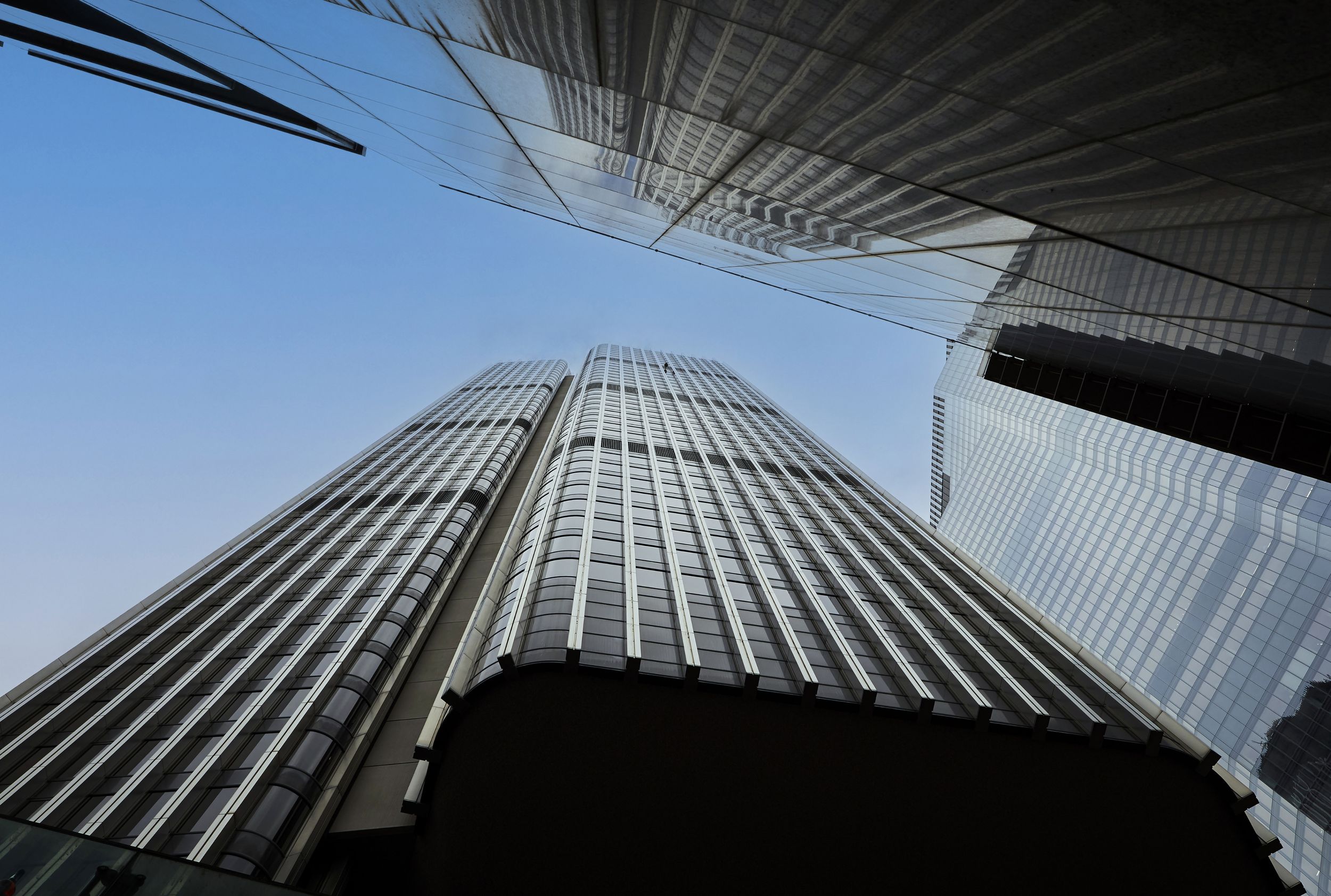 Tower 42's striking linear facade as seen from the ground floor retail pavilions