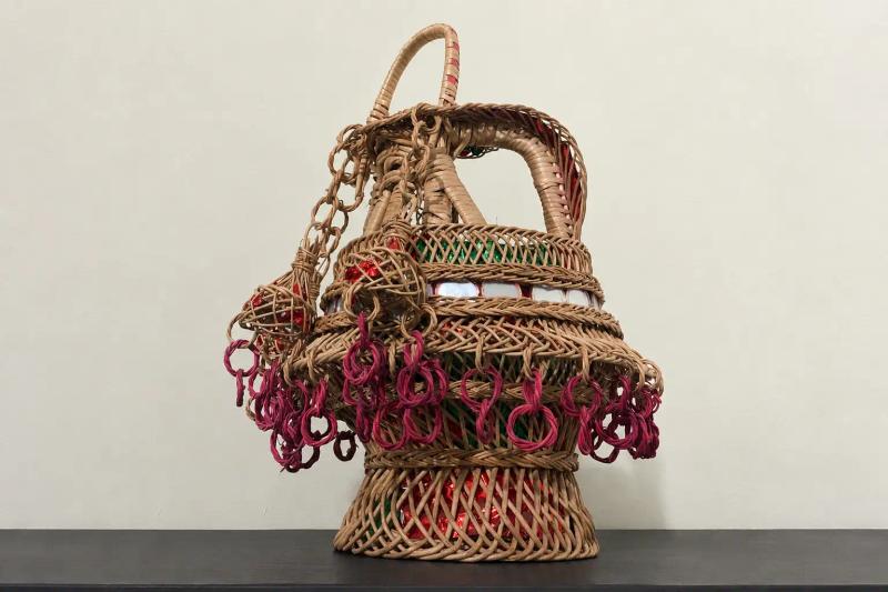 Chillai Kalan in Kashmir with a traditional handwoven Kashmiri decorative basket showcasing intricate wicker craftsmanship.