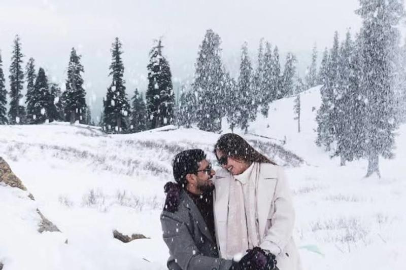 Best time to visit Kashmir for honeymoon in winter — Gulmarg Gondola rising above snow-covered Himalayan peaks