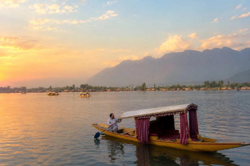Houseboats moored at dusk with reflections, Dal Lake vs Nigeen Lake houseboat stay