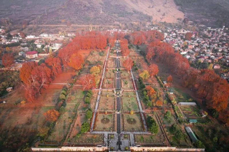 Aerial view of Nishat Bagh Srinagar with its central water channel, terraced lawns and autumn chinar trees