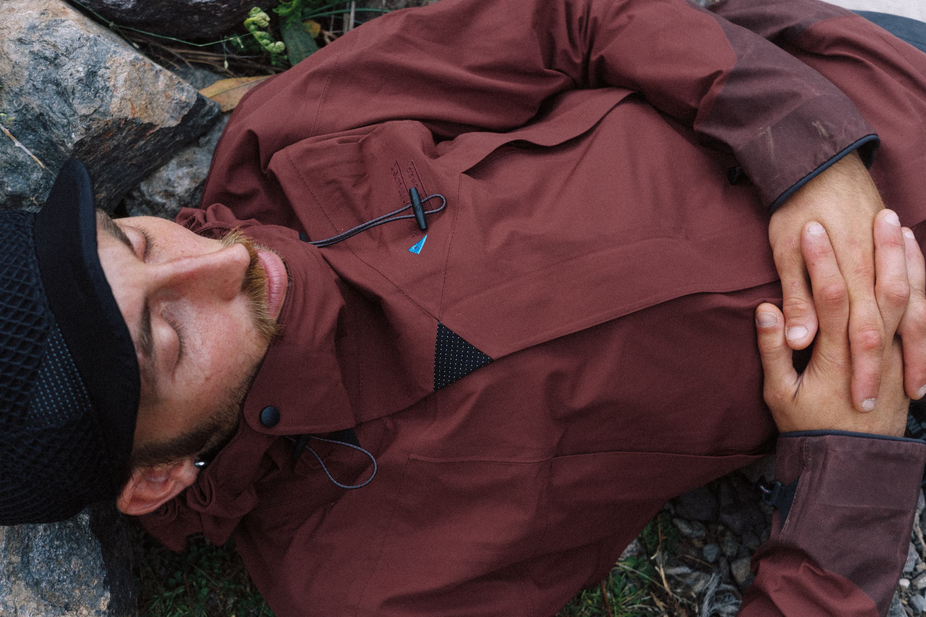 Man laying on a rock