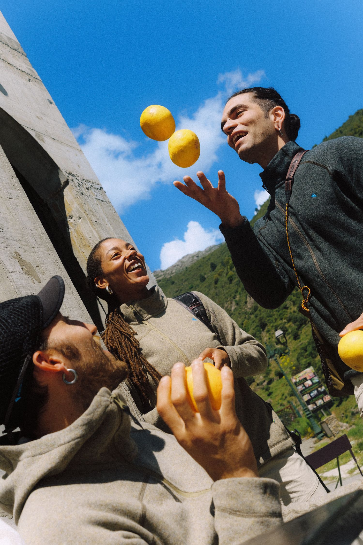 Man juggling oranges