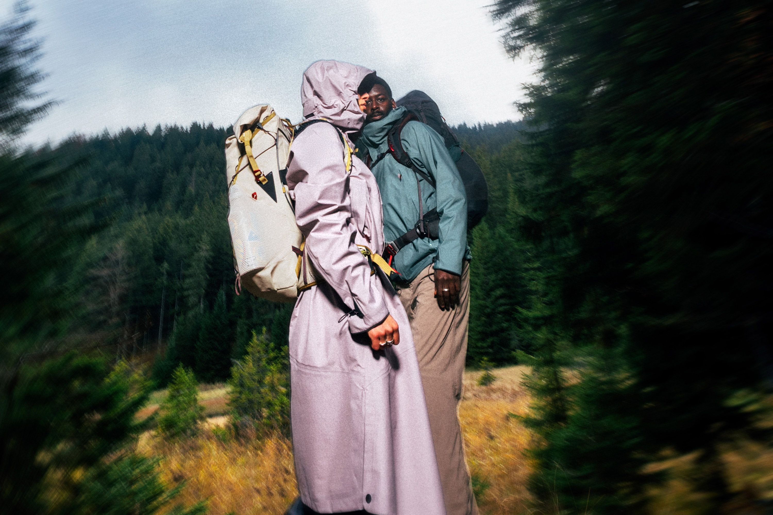 Man and woman standing in the woods