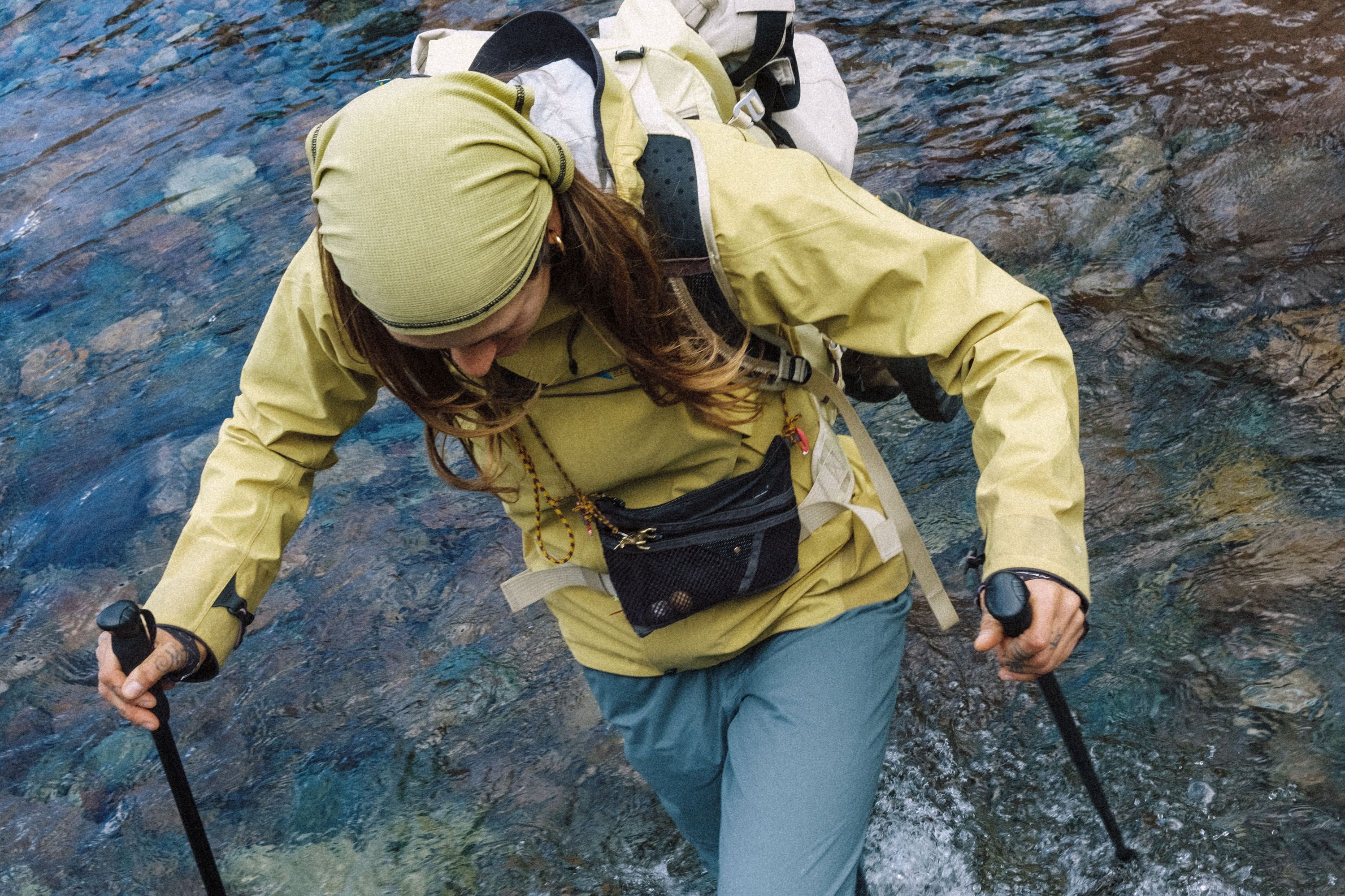 Woman walking across a river