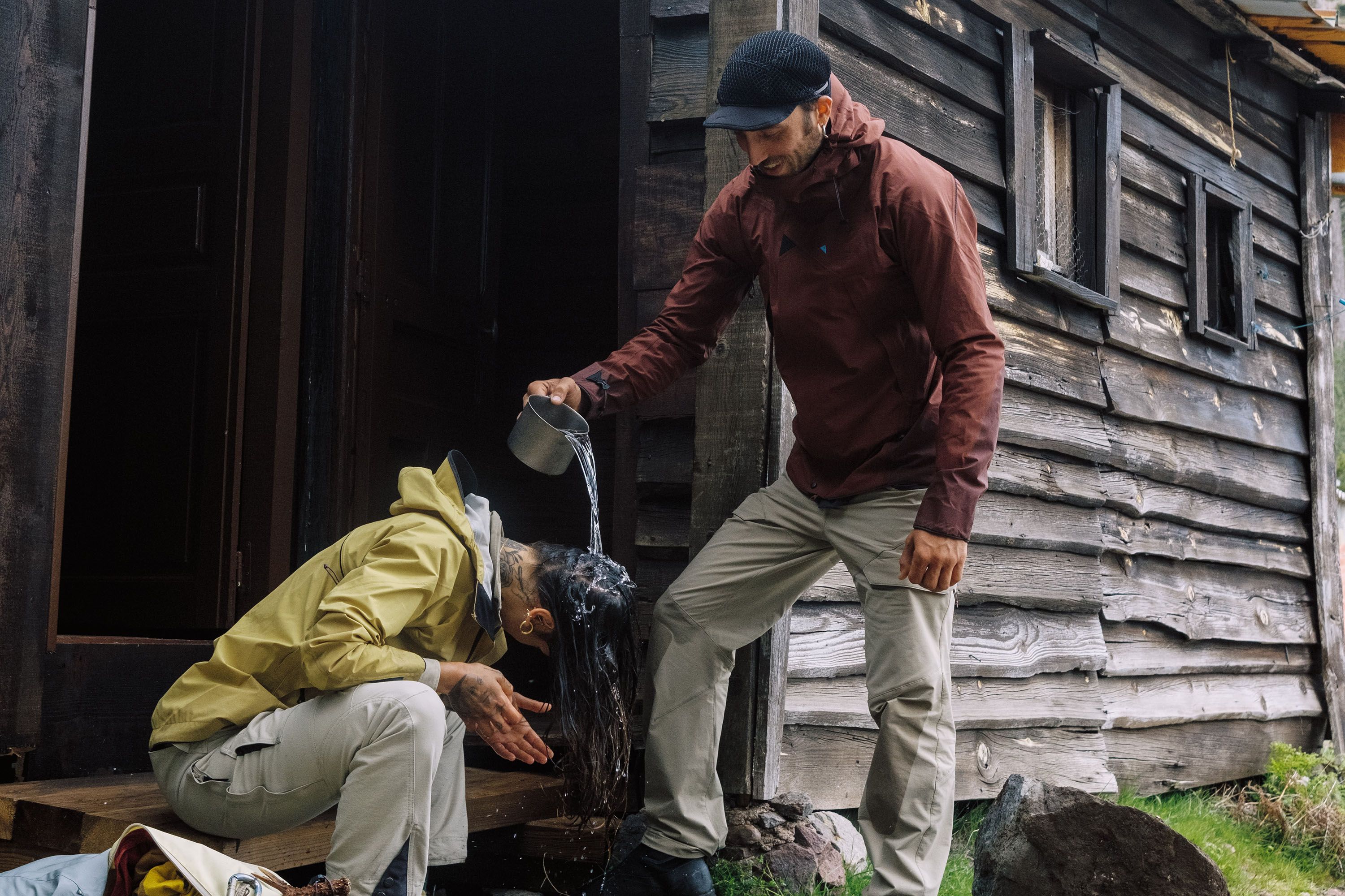 Man poring water on a woman's head