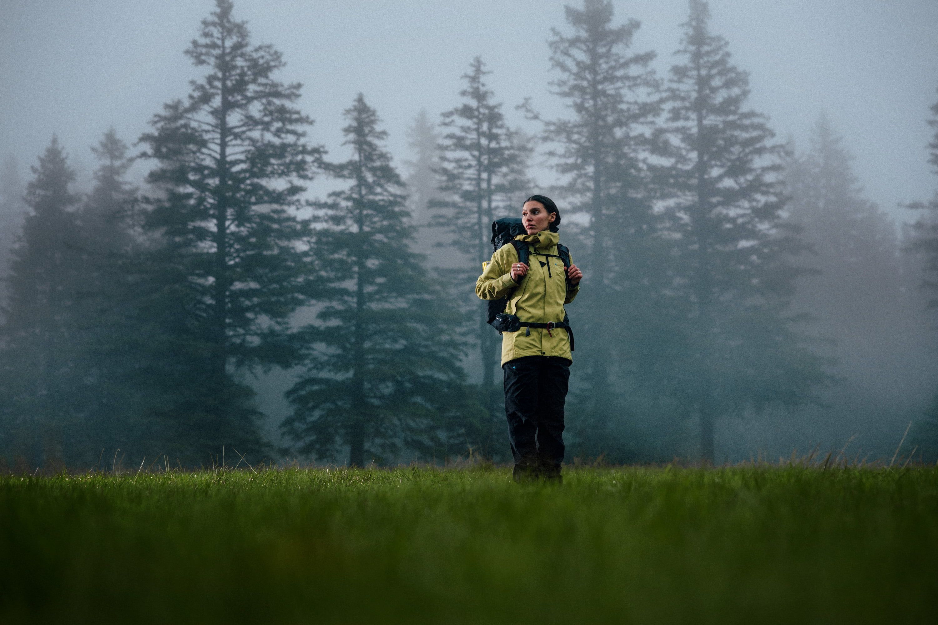 Woman walking across a river