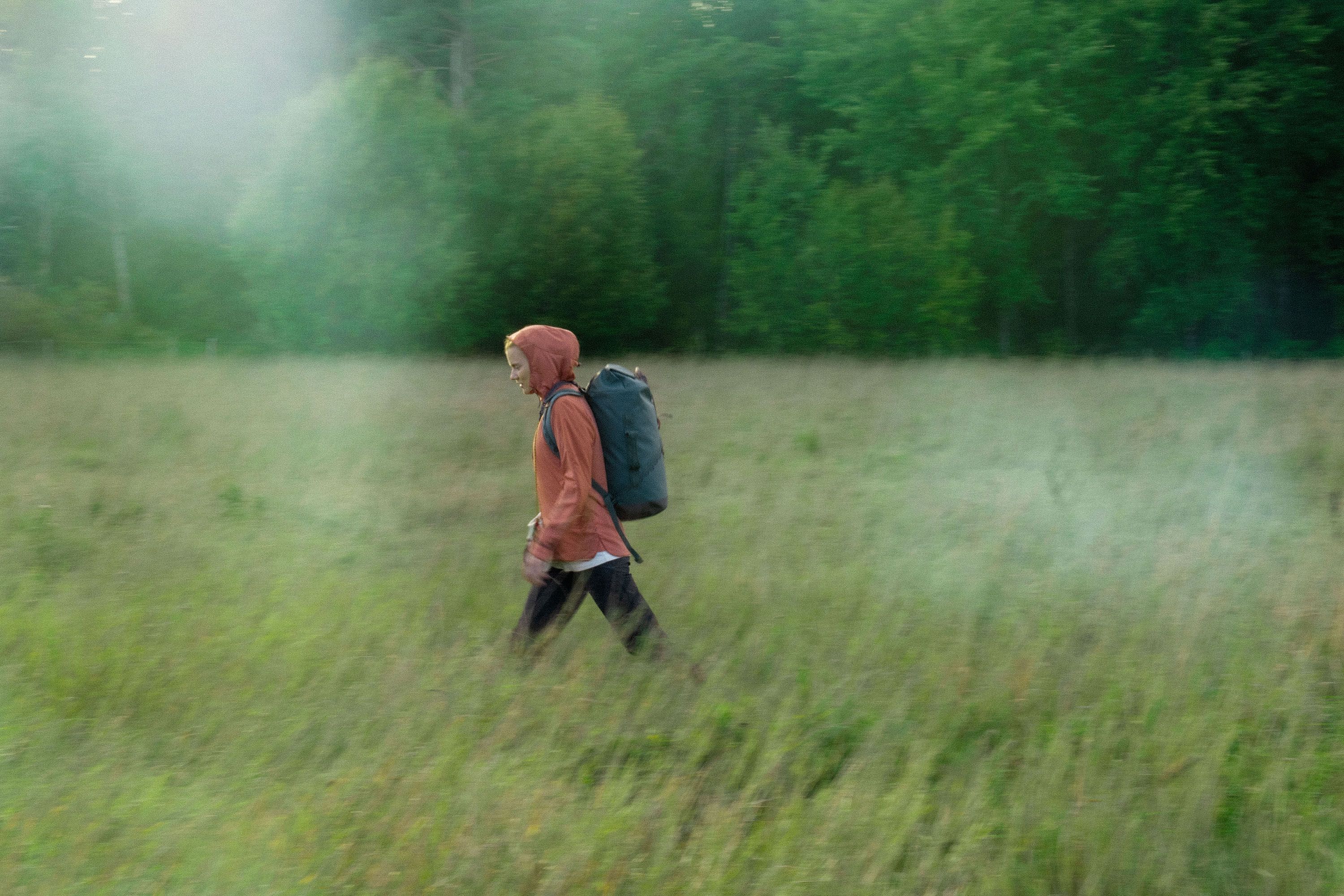 Woman walking on a grass field