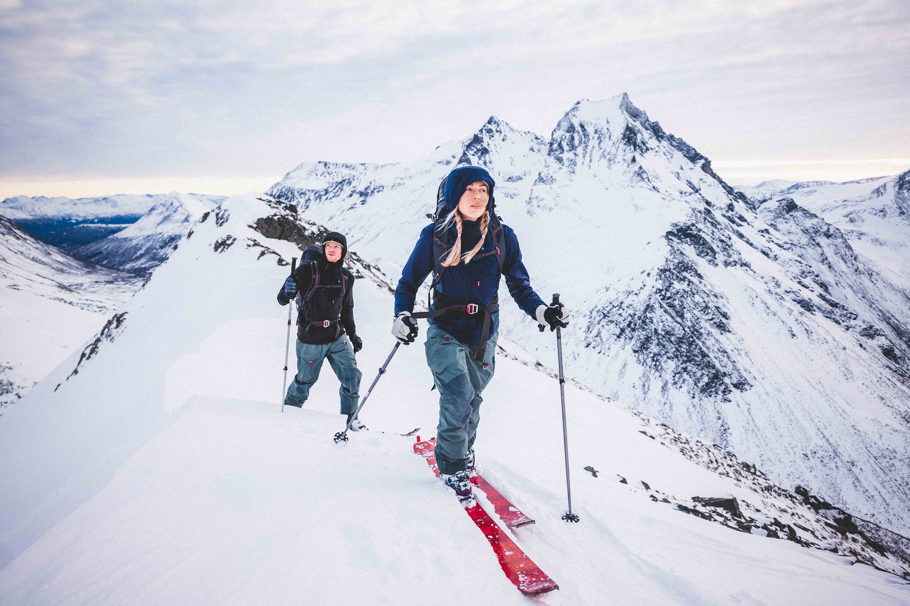 Man and woman ski touring