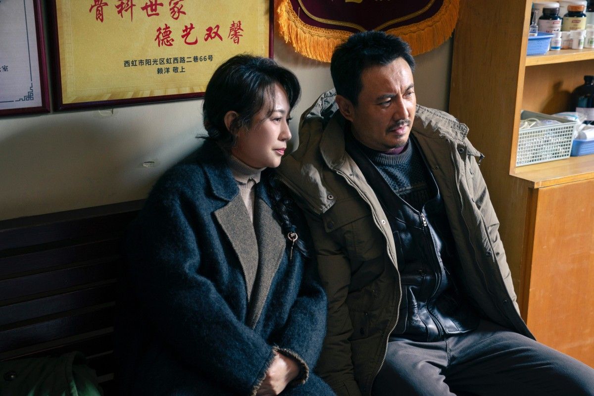 A scene from Successor showing the boy’s parents sitting together in a room