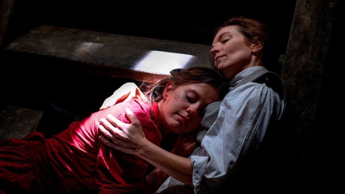 A scene from Pearl showing Pearl resting against her mother Ruth