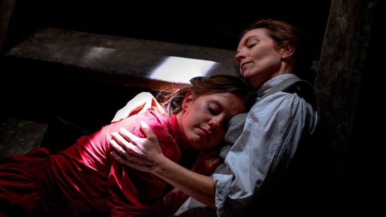 A scene from Pearl showing Pearl resting against her mother Ruth