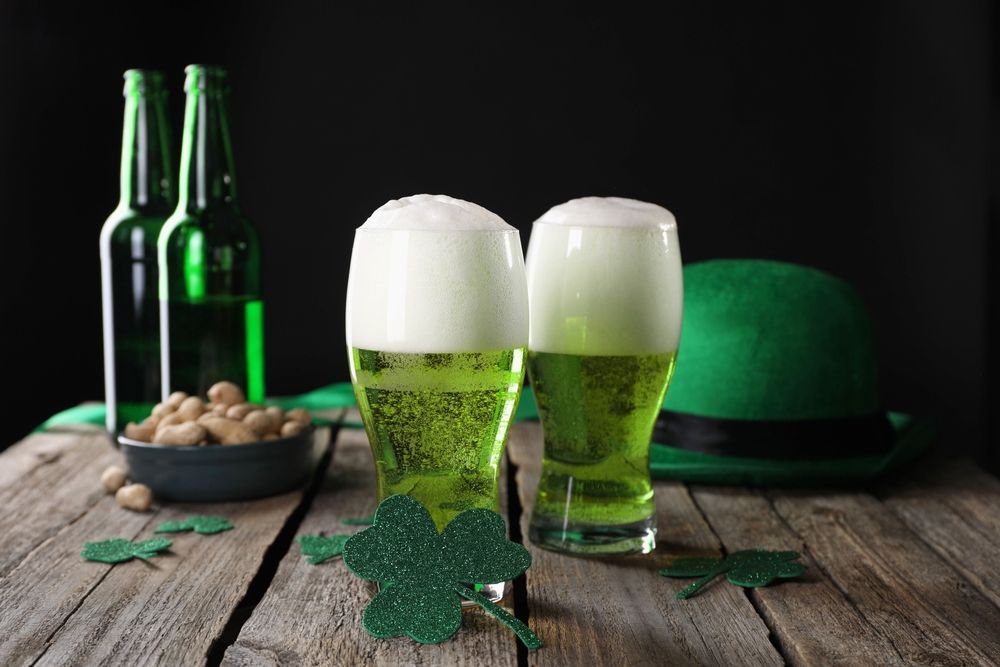 Green beer glasses and shamrock decorations representing St. Patrick’s Day celebrations and the risks of drunk driving accidents in Houston