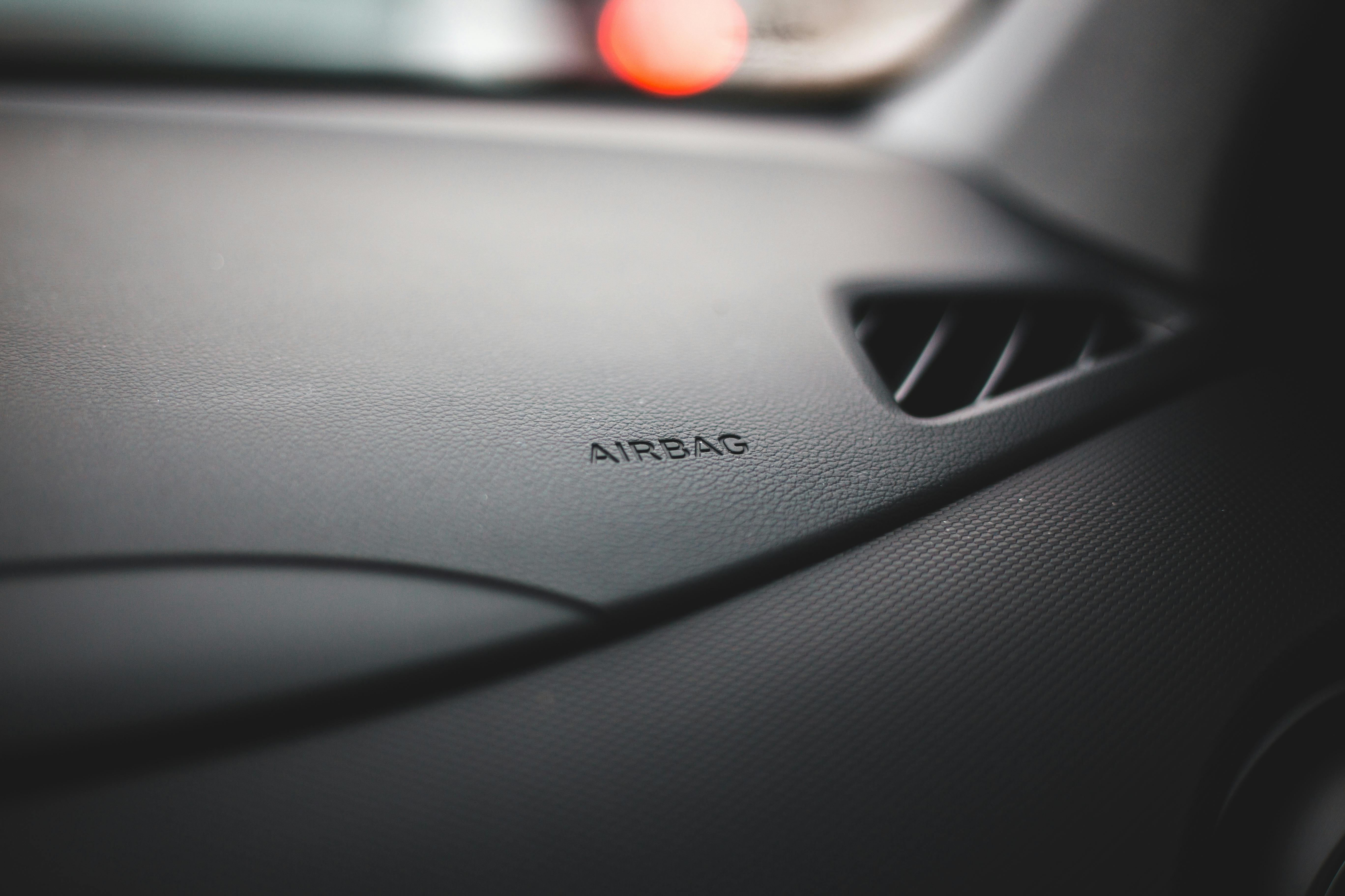 Image Close-up of a vehicle airbag panel for a blog explaining defective airbag injury claims after Dallas car accidents.