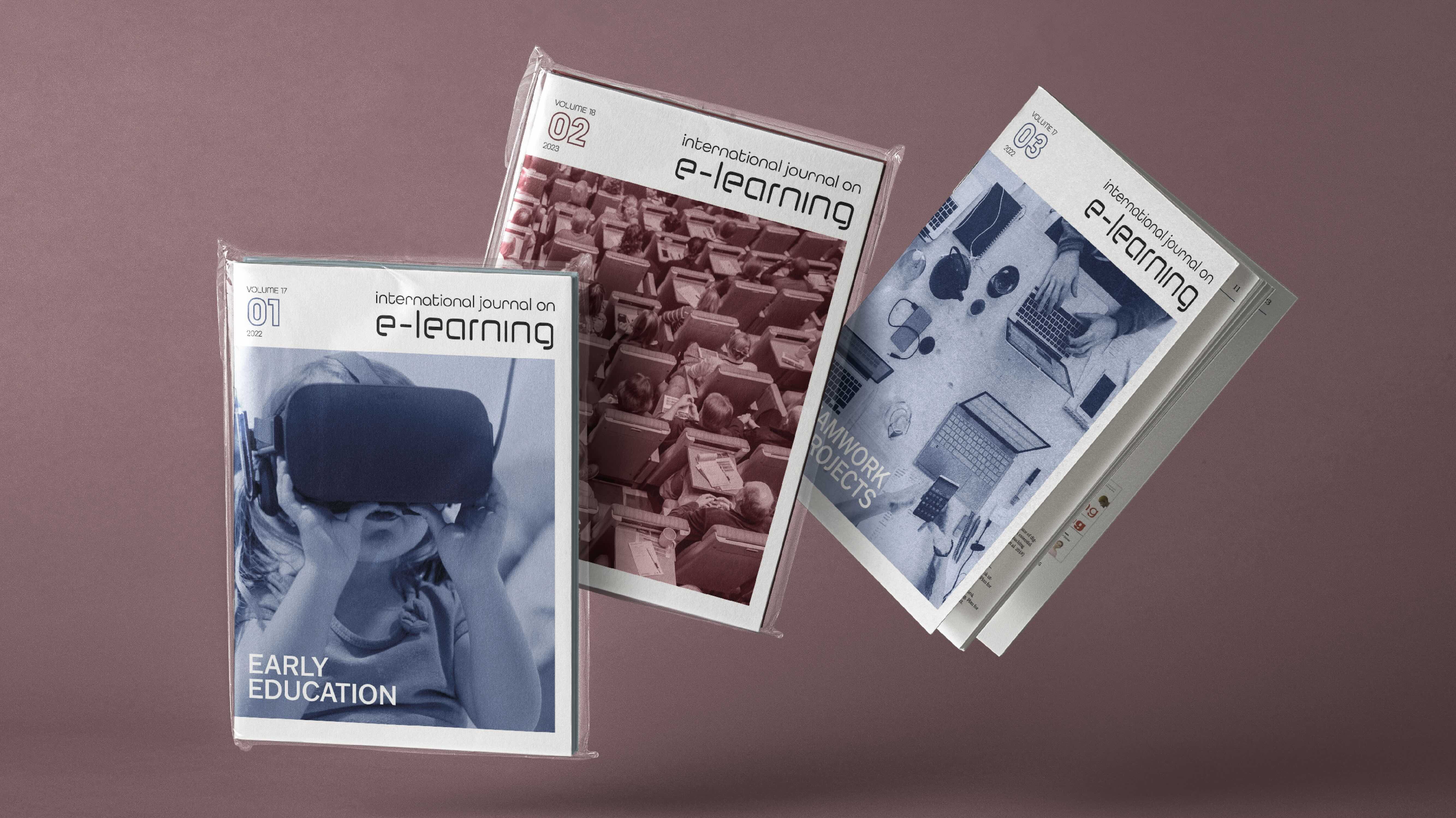 Tre fiktive utgaver av tidsskriftet International Journal on E-learing. To av dem er pakket i plastfolie, mens den tredje er litt åpen og viser litt av innholdet. Foto mockup.