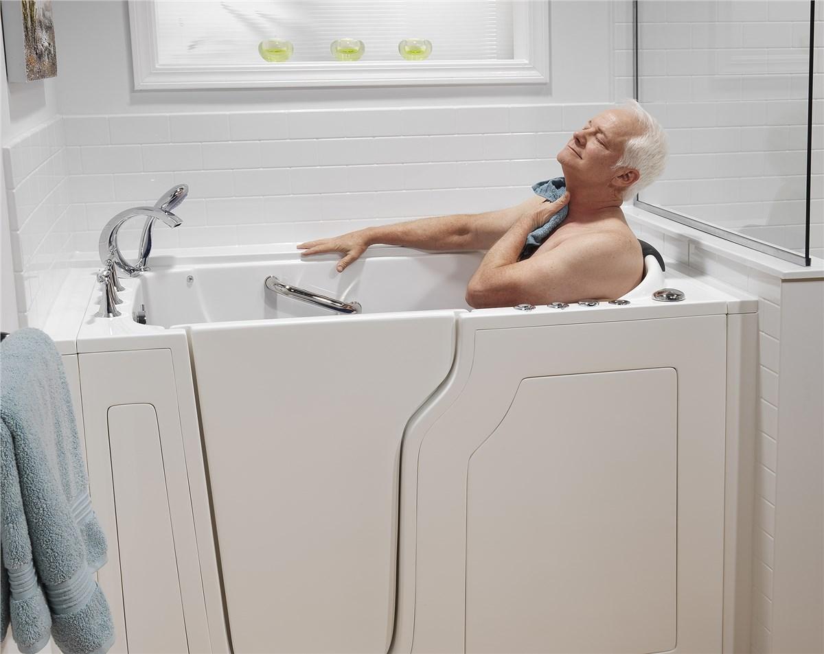 senior man washing in a BCI walk-in tub