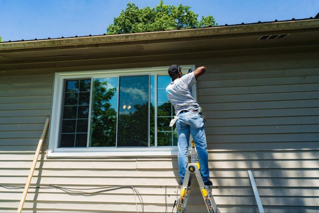 Renuity professional installing a window