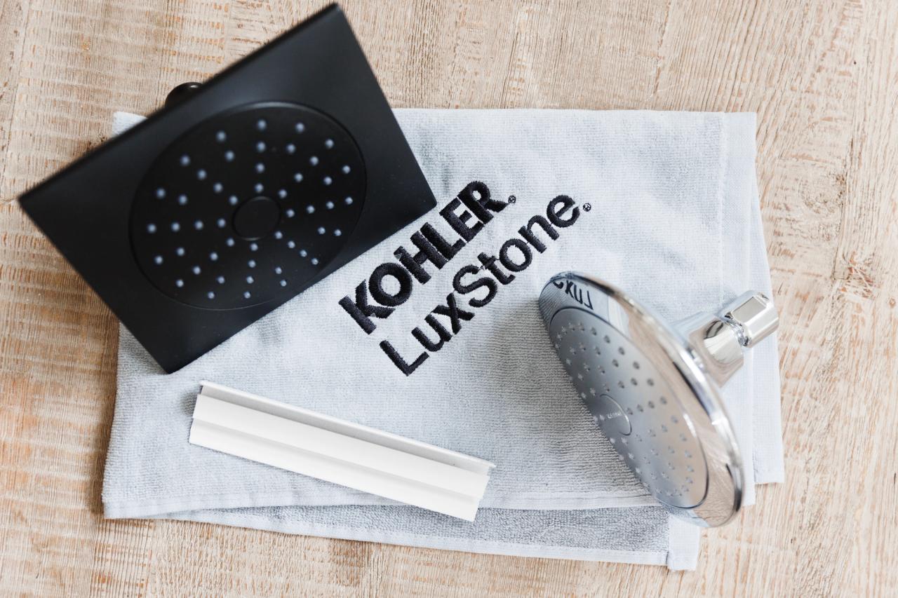 KOHLER LuxStone-branded cleaning cloth with shower heads placed upon it