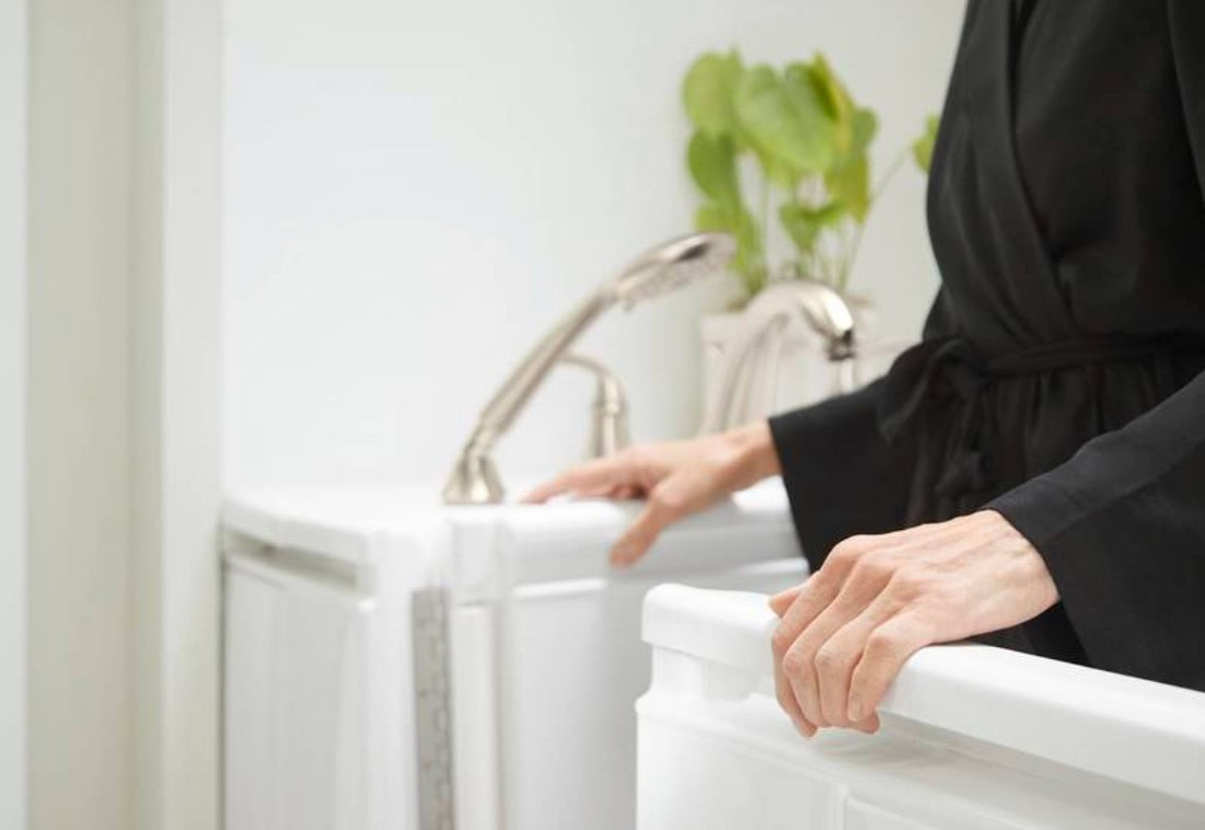 older adult exiting walk-in bath