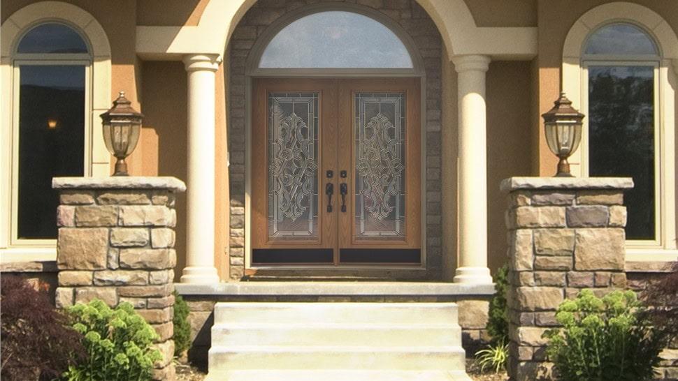 large home entrance with arch