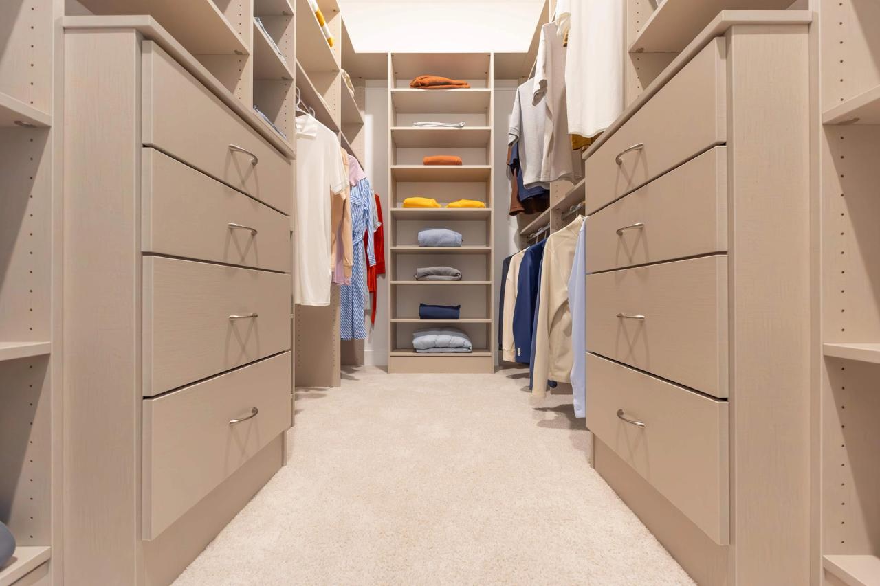 custom walk-in closet with beige finish
