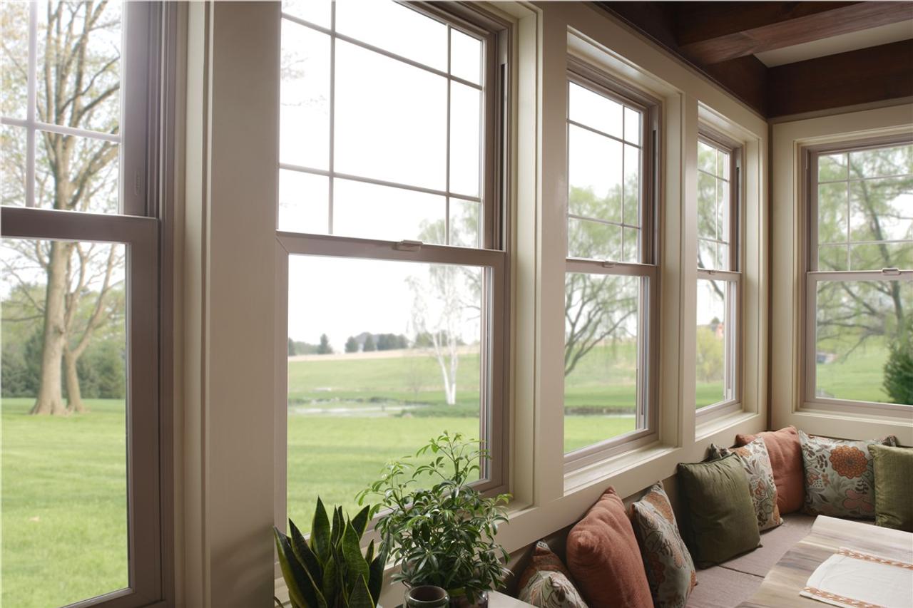 interior shot of a living room with beige vinyl windows