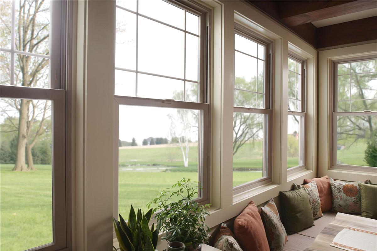 interior shot of a living room with beige vinyl windows