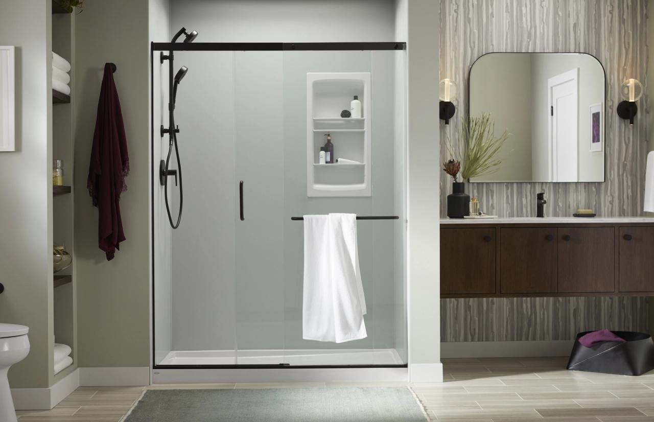 KOHLER walk-in shower with black finish fixtures