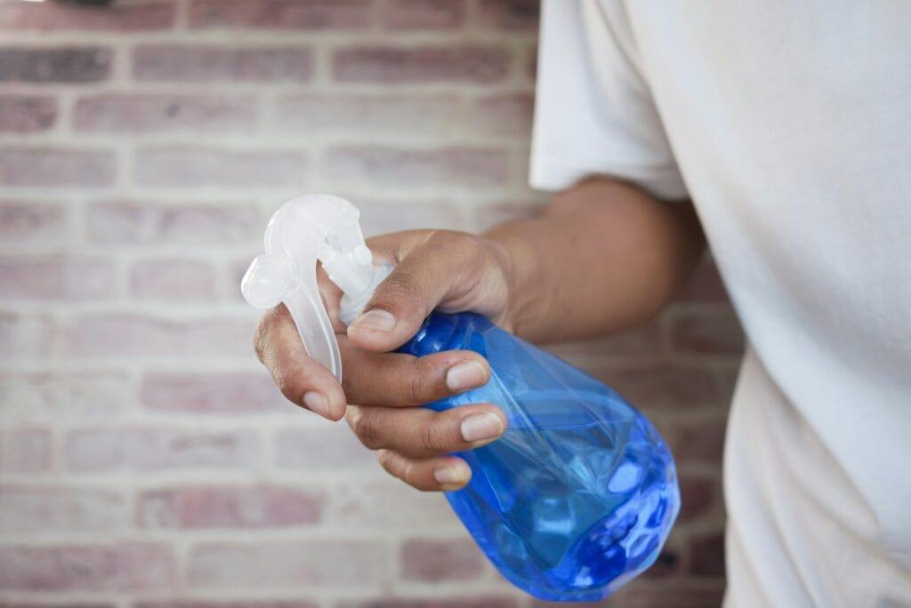 man holding a spray bottle