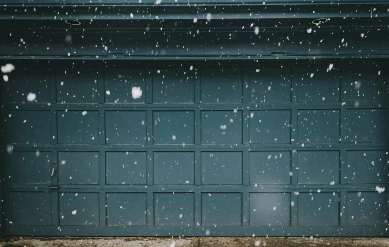 Snow in front of a garage door