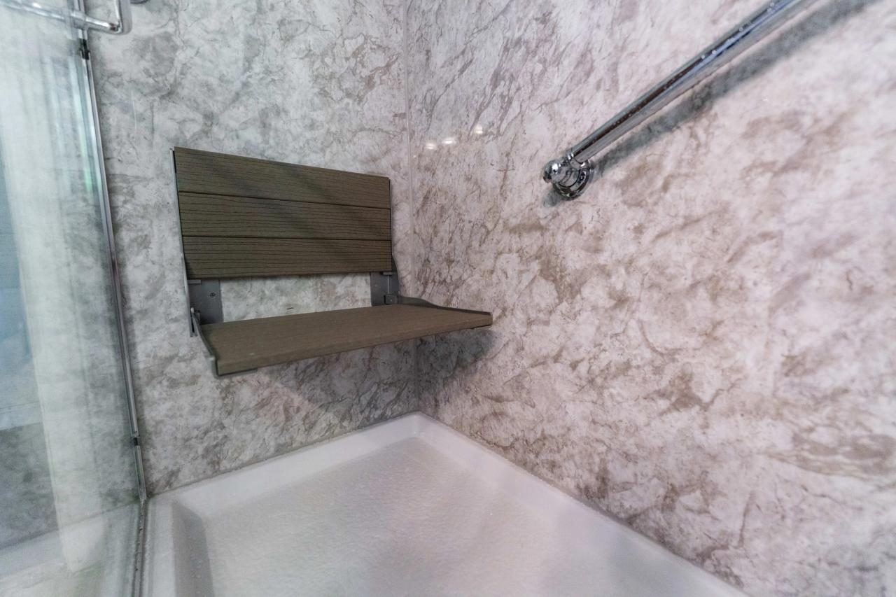 walk-in shower seating and grab bar