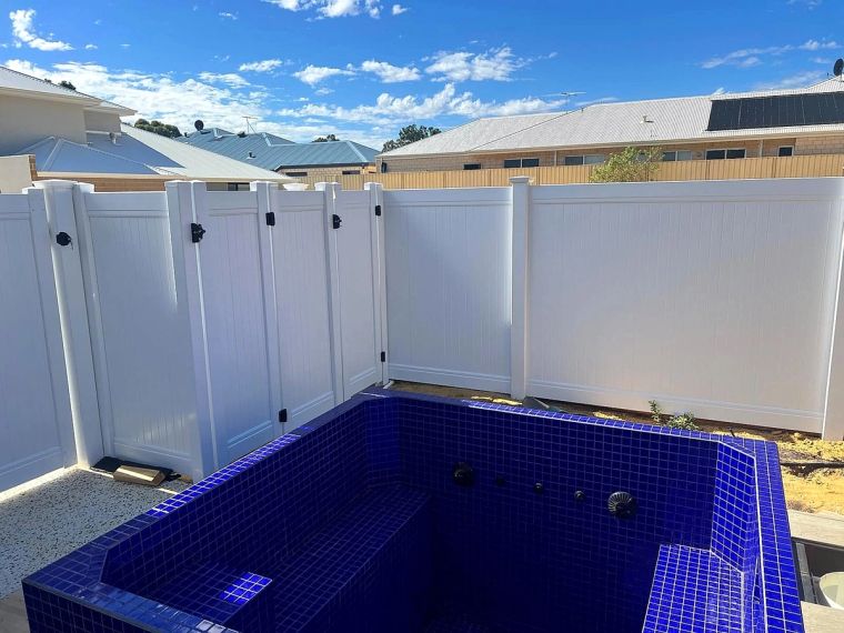 White PVC fencing enclosing a tiled pool on a Perth Hills property